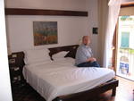 our hotel room 3:  Isaac seated on bed