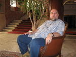 Isaac enthroned in hotel lobby